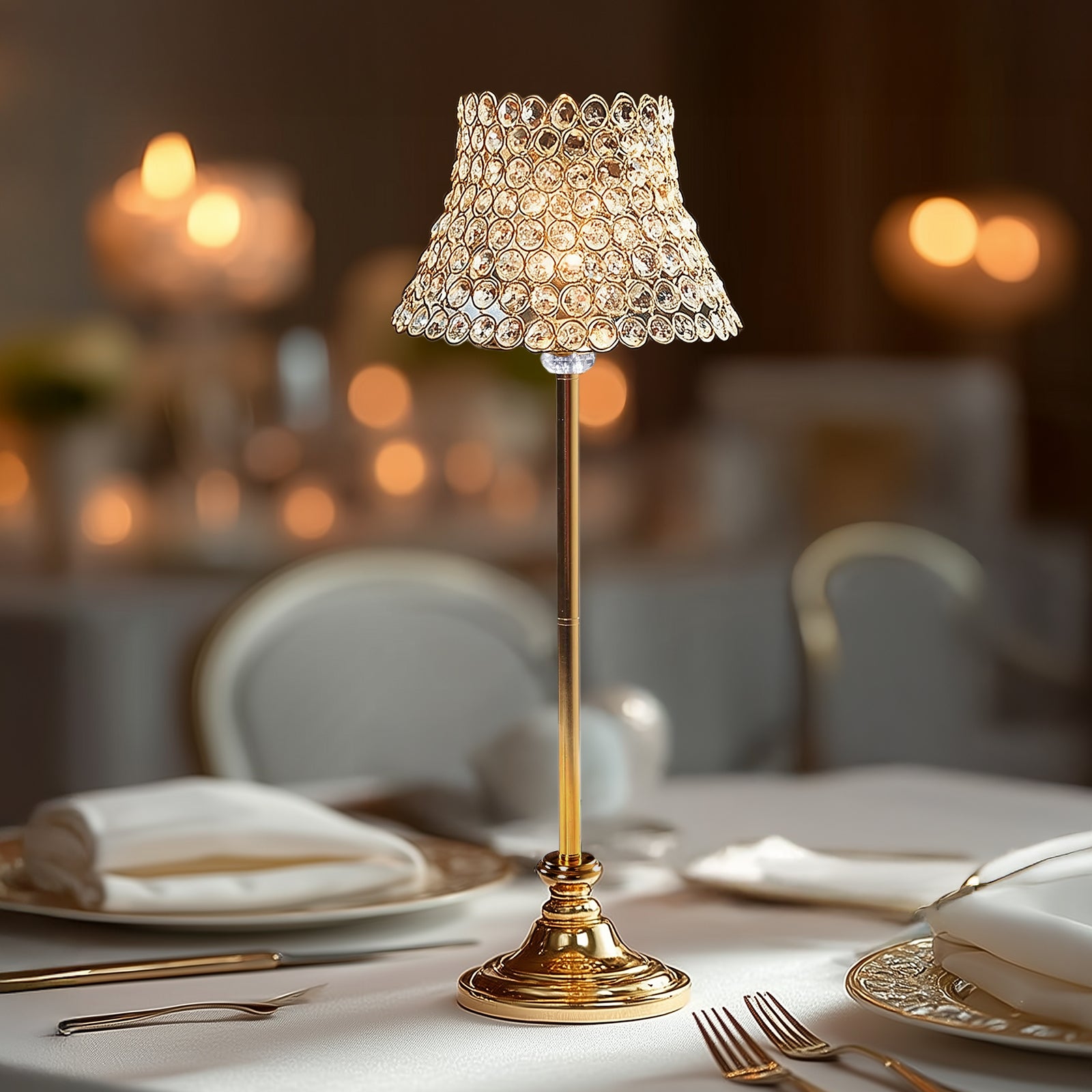 Gold crystal beaded candle stand with lamp-inspired shade for elegant table decor.