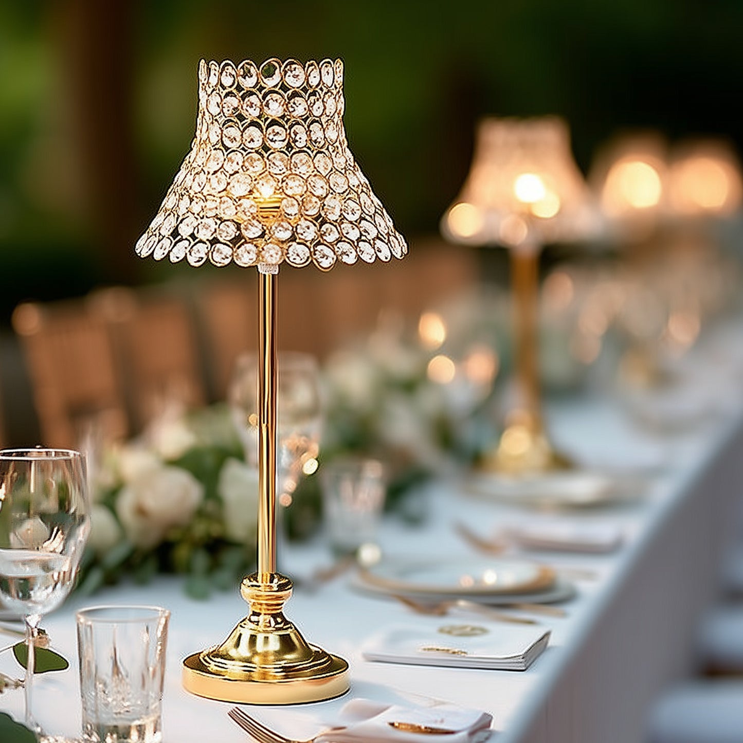 Gold crystal beaded candle stand with lamp-inspired shade for elegant tables.