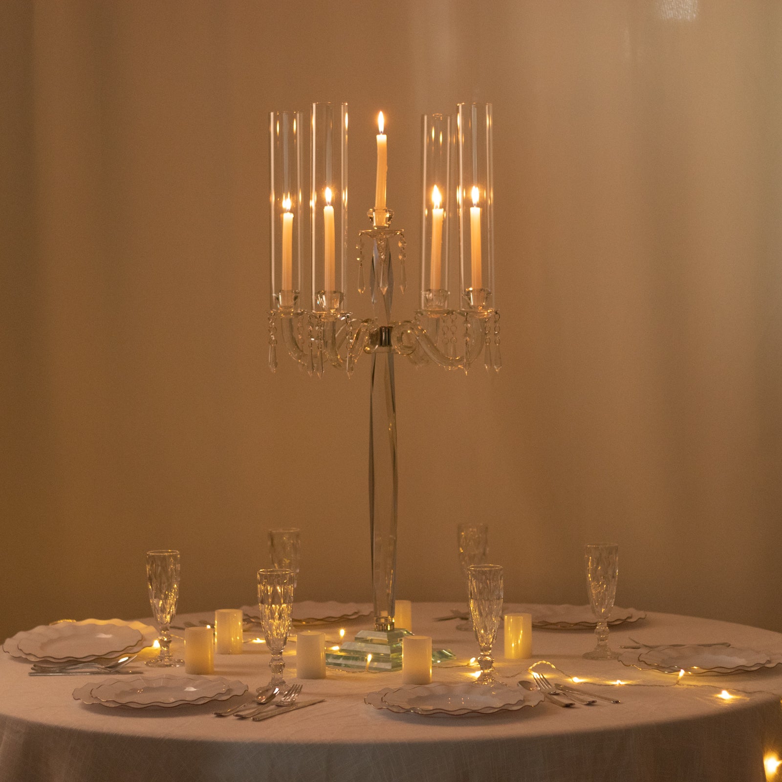 Elegant crystal candelabra taper candle holder centerpiece with hurricane glass shades.