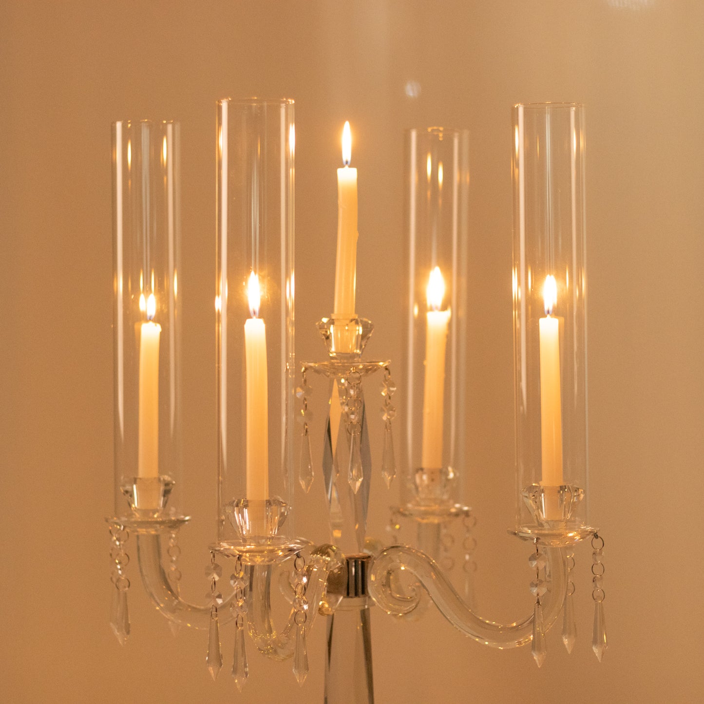 Elegant crystal candelabra taper candle holder with hurricane glass shades.