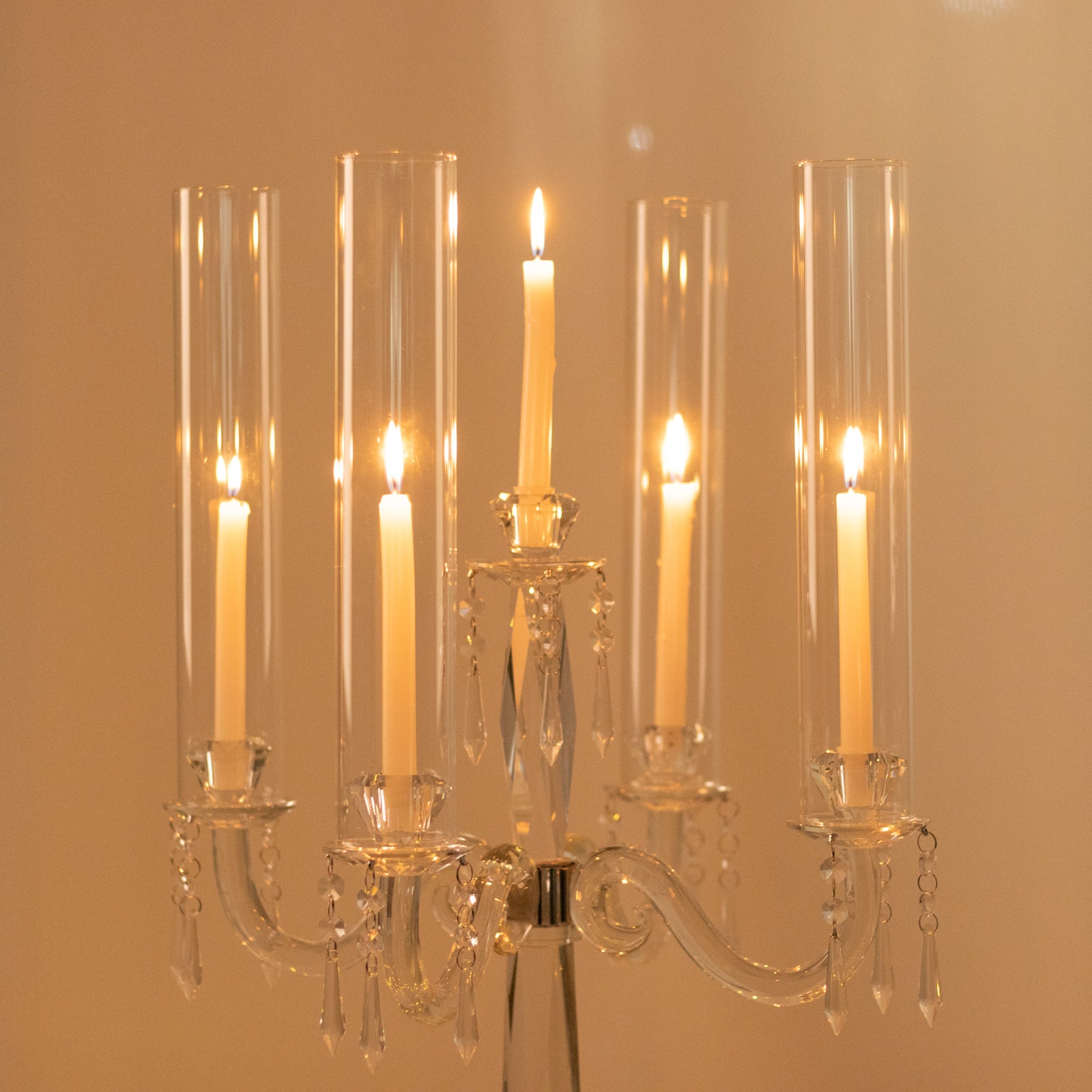 Elegant crystal candelabra taper candle holder with hurricane glass shades.
