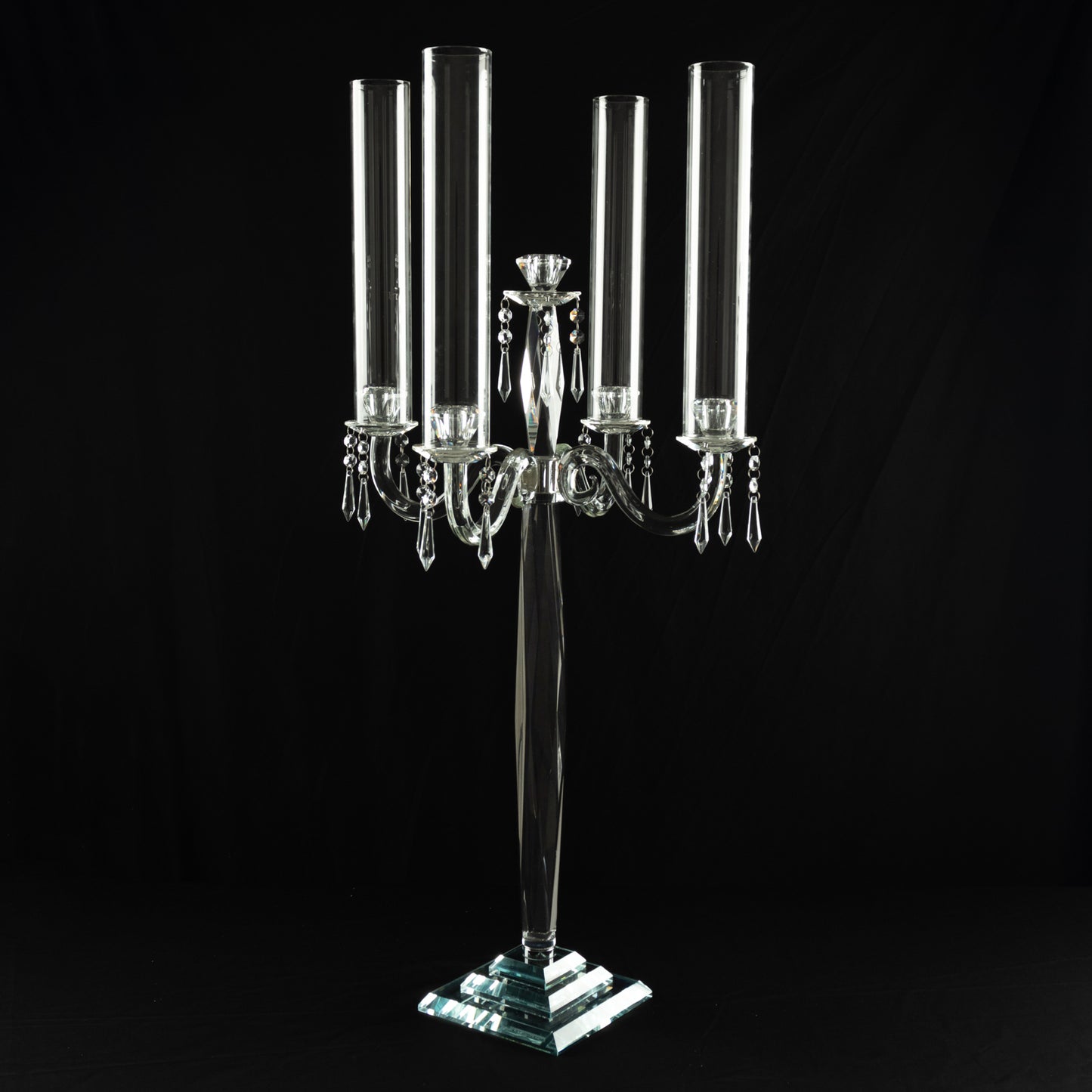 Elegant crystal candelabra taper candle holder with hurricane glass shades.