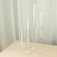 Set of 4 clear acrylic hurricane candle stands with tall chimneys.