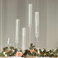 Clear acrylic hurricane candle stands with tall chimney shades.