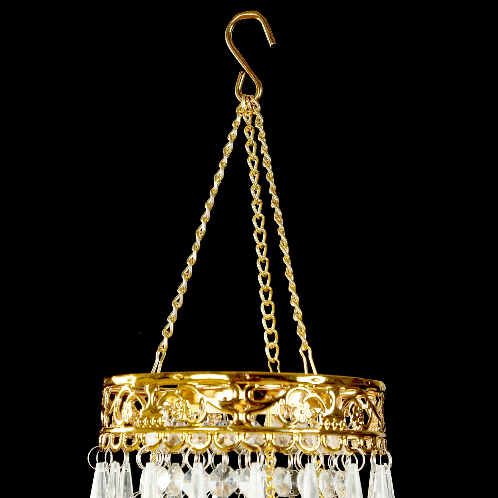 Gold beaded crystal chandelier with ornate metal frame.