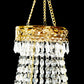 Gold beaded crystal chandelier with ornate metal frame.