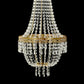 Gold beaded crystal chandelier with ornate metal frame.