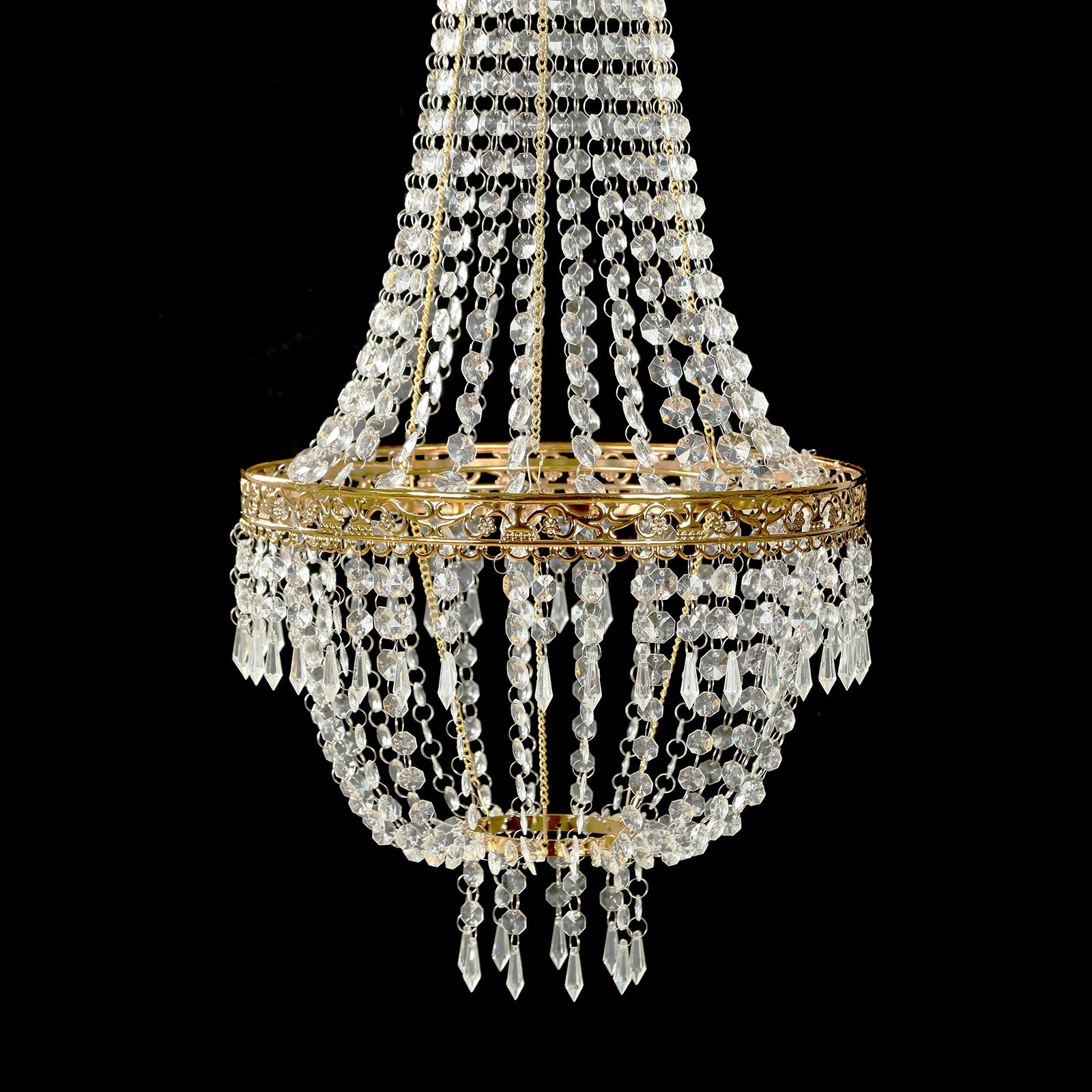 Gold beaded crystal chandelier with ornate metal frame.