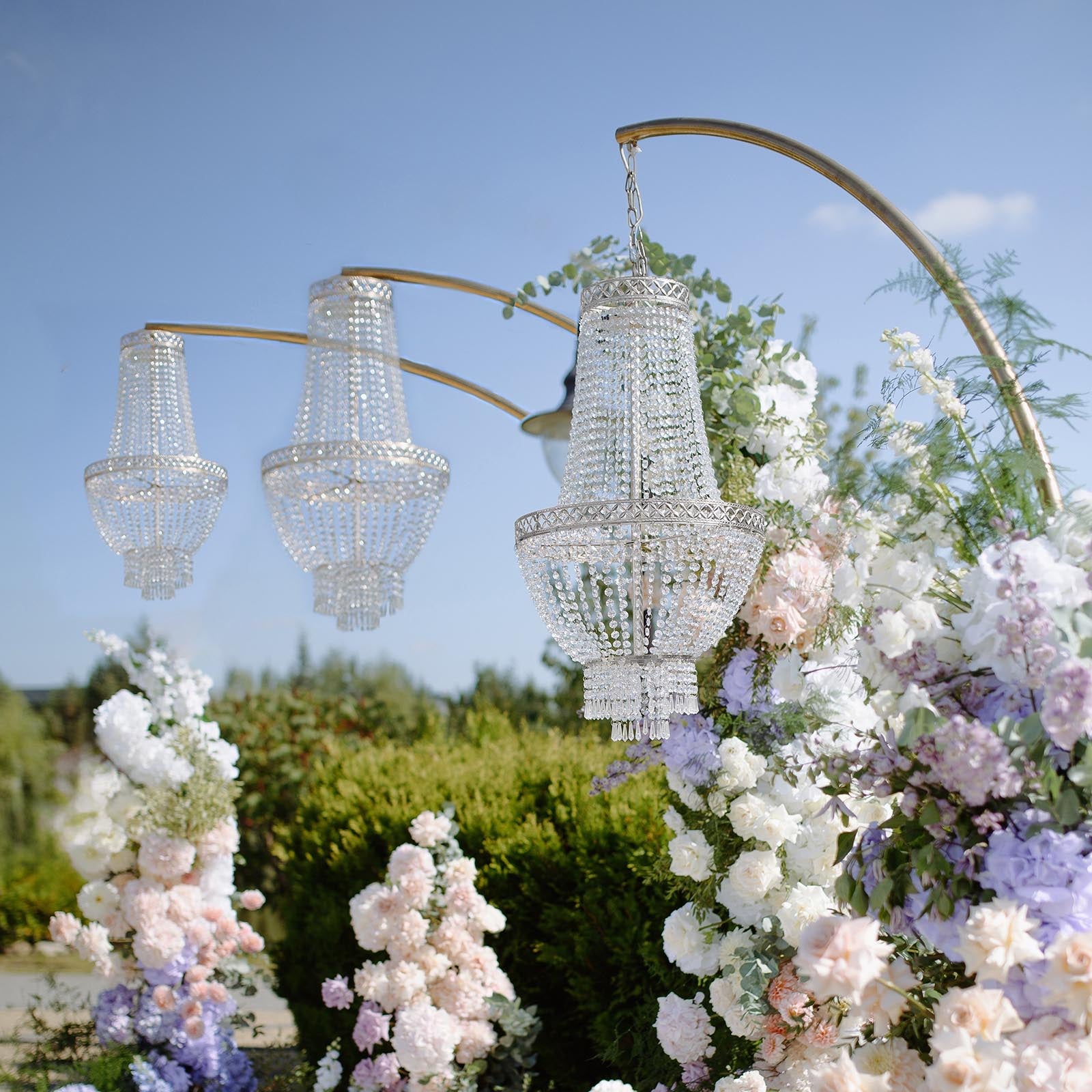 Beaded crystal chandelier with silver ornate frame, adjustable pendant lighting.