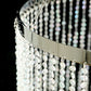 Clear crystal beaded chandelier with silver metal hoop and chain.