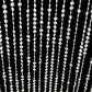 Clear beaded crystal chandelier with silver metal hoop and hanging chain.
