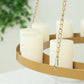 Gold floral chandelier frame with candle display.