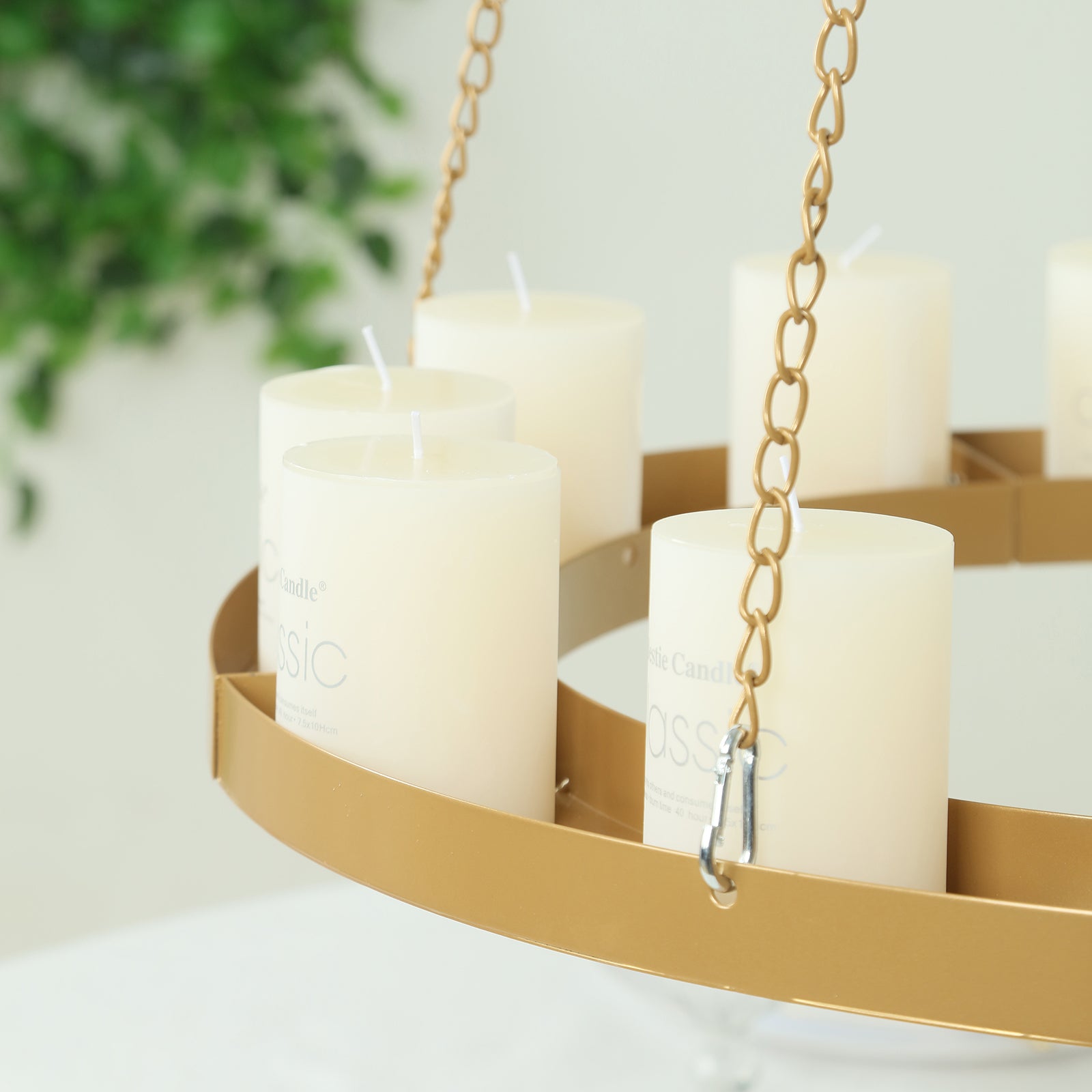 Gold floral chandelier frame with candle display.