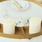 Gold floral chandelier frame with candles and floral display.