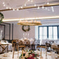 Gold floral chandelier frame with candle holders, elegant lighting for events.