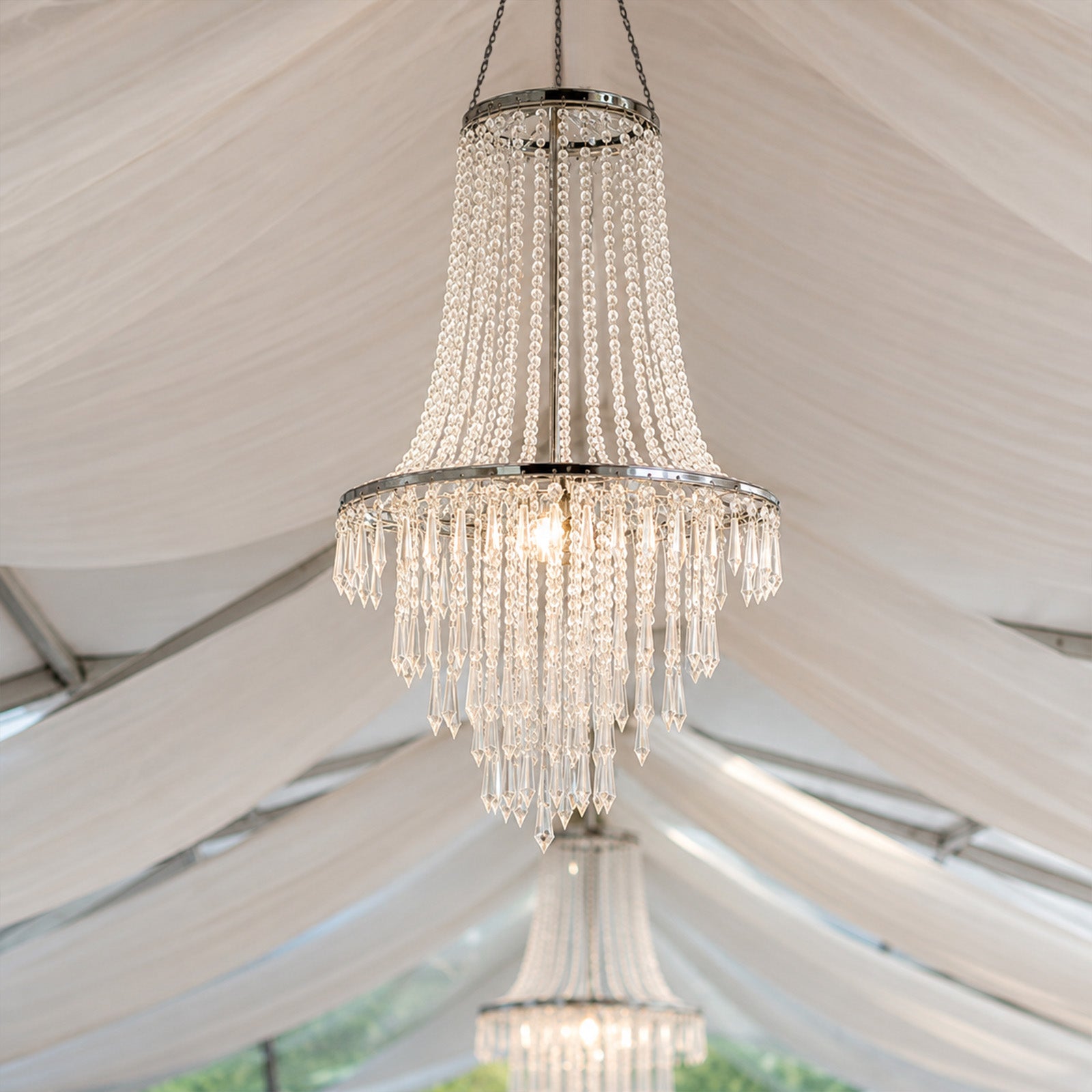 Elegant silver chandelier with crystal beads in an elegant setting.