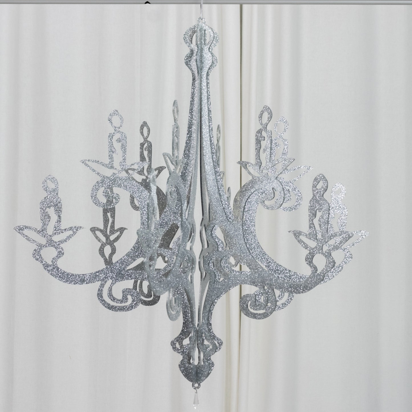 Silver glittered acrylic chandelier decor with 3D interlocking design.