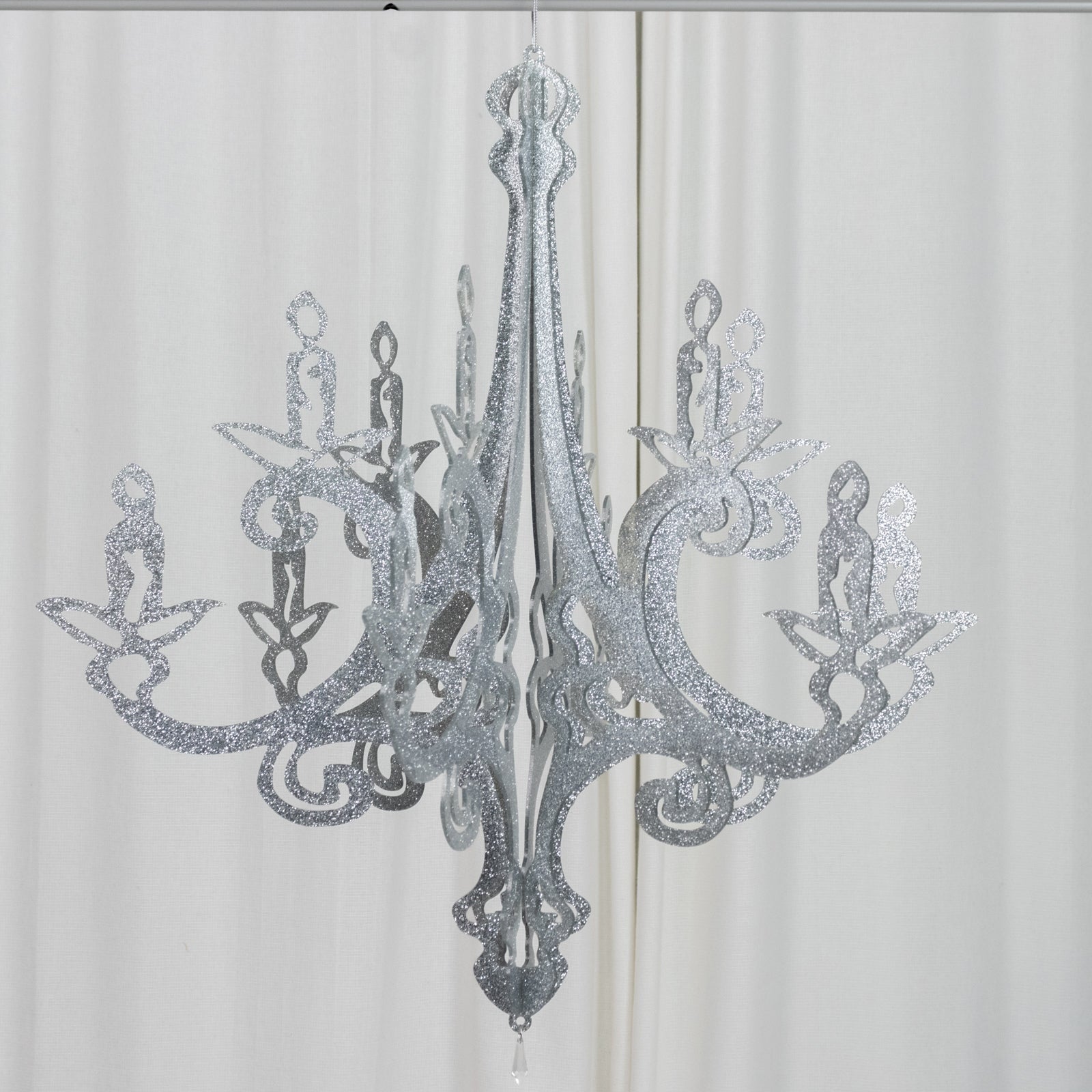 Silver glittered acrylic chandelier decor with 3D interlocking design.