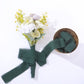 Hunter emerald green chiffon ribbon with floral arrangement, perfect for DIY projects.