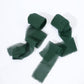 Hunter emerald green chiffon ribbon rolls for DIY projects.