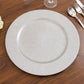 Silver glitter acrylic round charger plate on a wooden table.