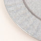Silver galvanized metal charger plate with ruffled rim.