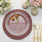 Matte burgundy hammered charger plate with floral decor and elegant table setting.