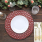 Matte burgundy hammered charger plate on a rustic table setting.