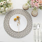 Matte gray hammered charger plate with white dinner plate and flowers.