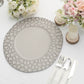 Matte gray hammered charger plate on a table setting with flowers and candles.
