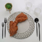 Gray hammered charger plate set with modern design, perfect for dinner serving.