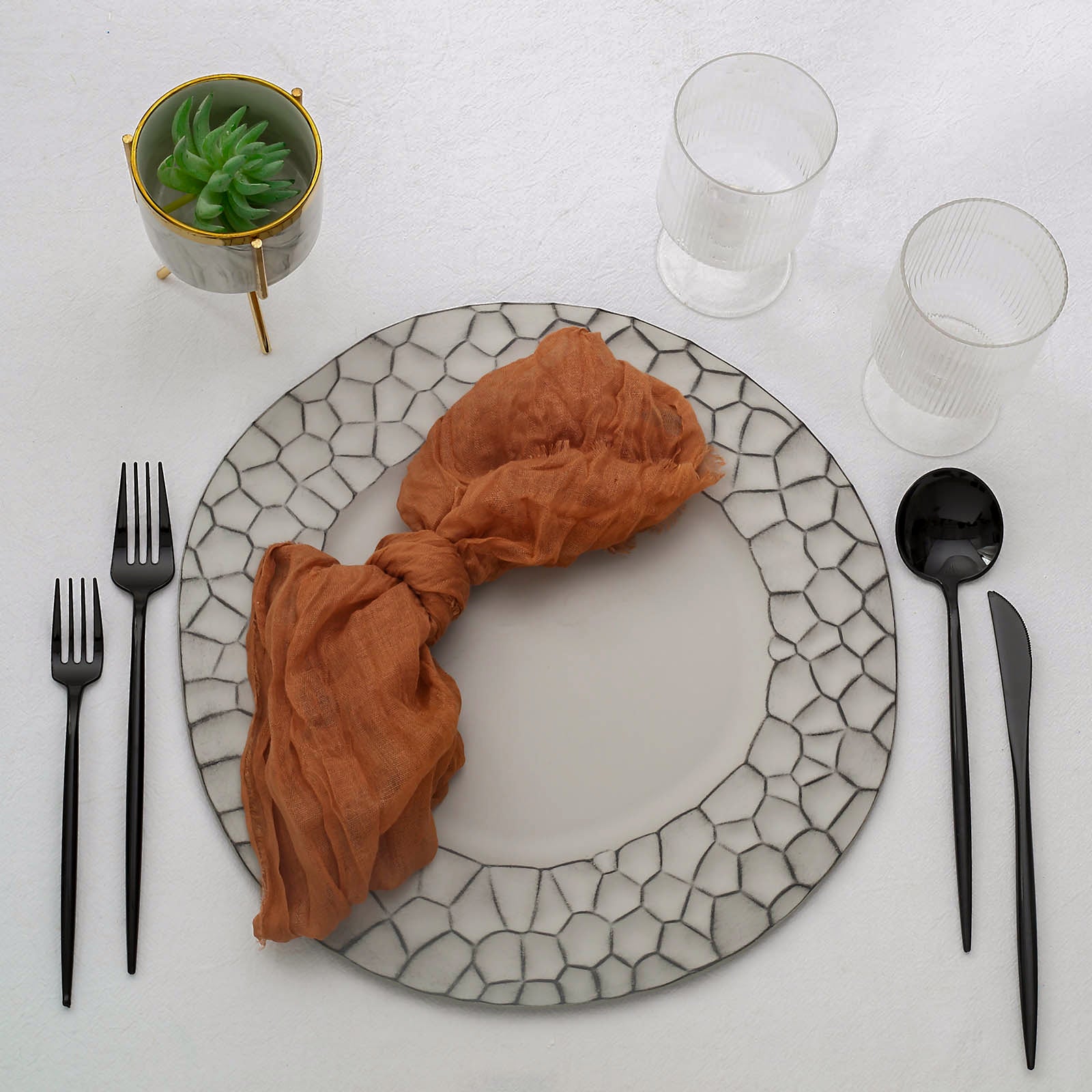 Gray hammered charger plate set with modern design, perfect for dinner serving.