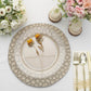 Matte taupe hammered charger plate with floral decor and elegant table setting.