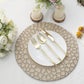 Matte taupe hammered charger plates on a dining table setting.