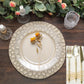 Matte taupe hammered charger plate with floral decor on a wooden table.