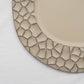 Matte taupe hammered charger plate with modern design, perfect for dinner serving.