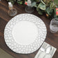 White decorative plate with textured border on rustic table setting.