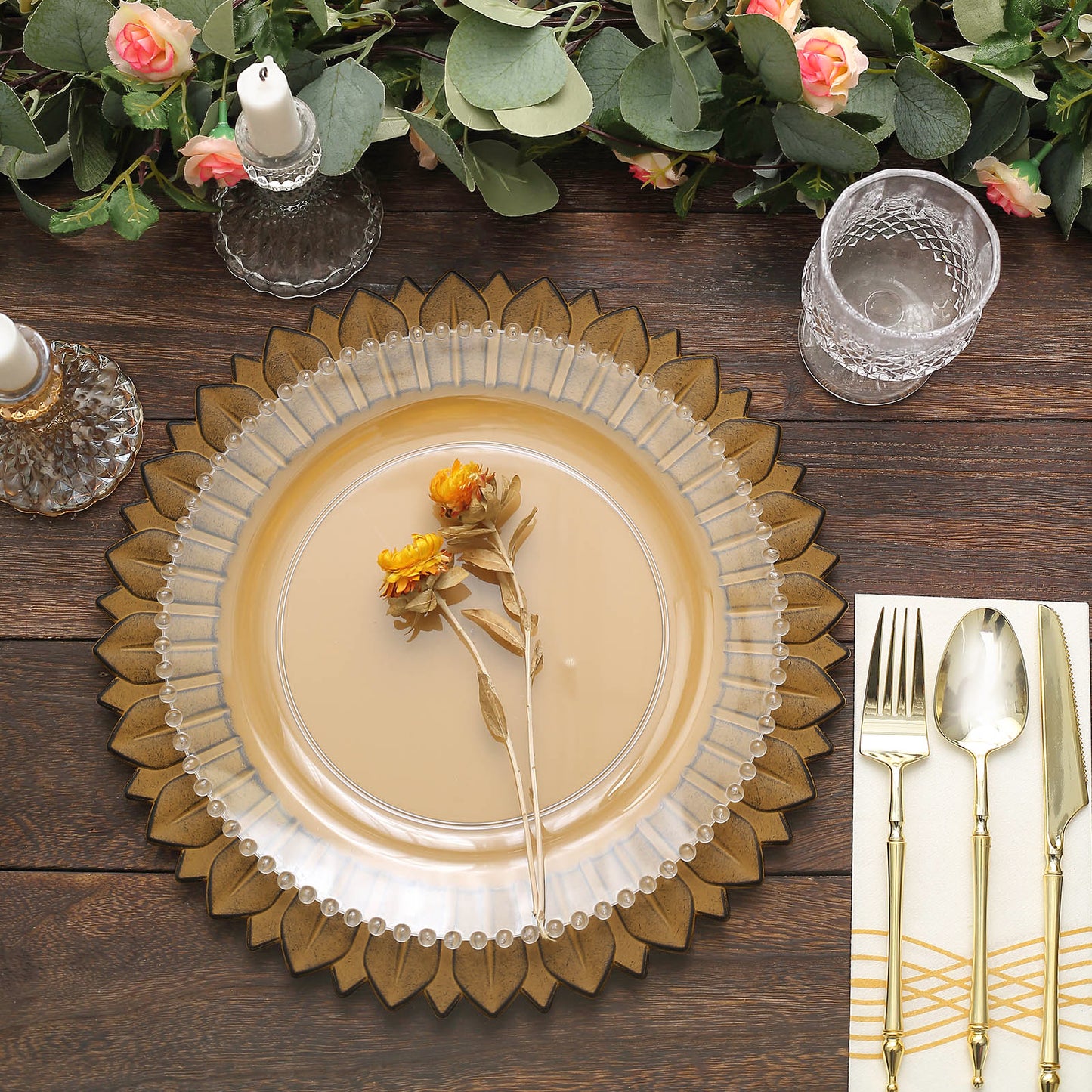 Matte mustard yellow sunflower charger plates on a wooden table setting.