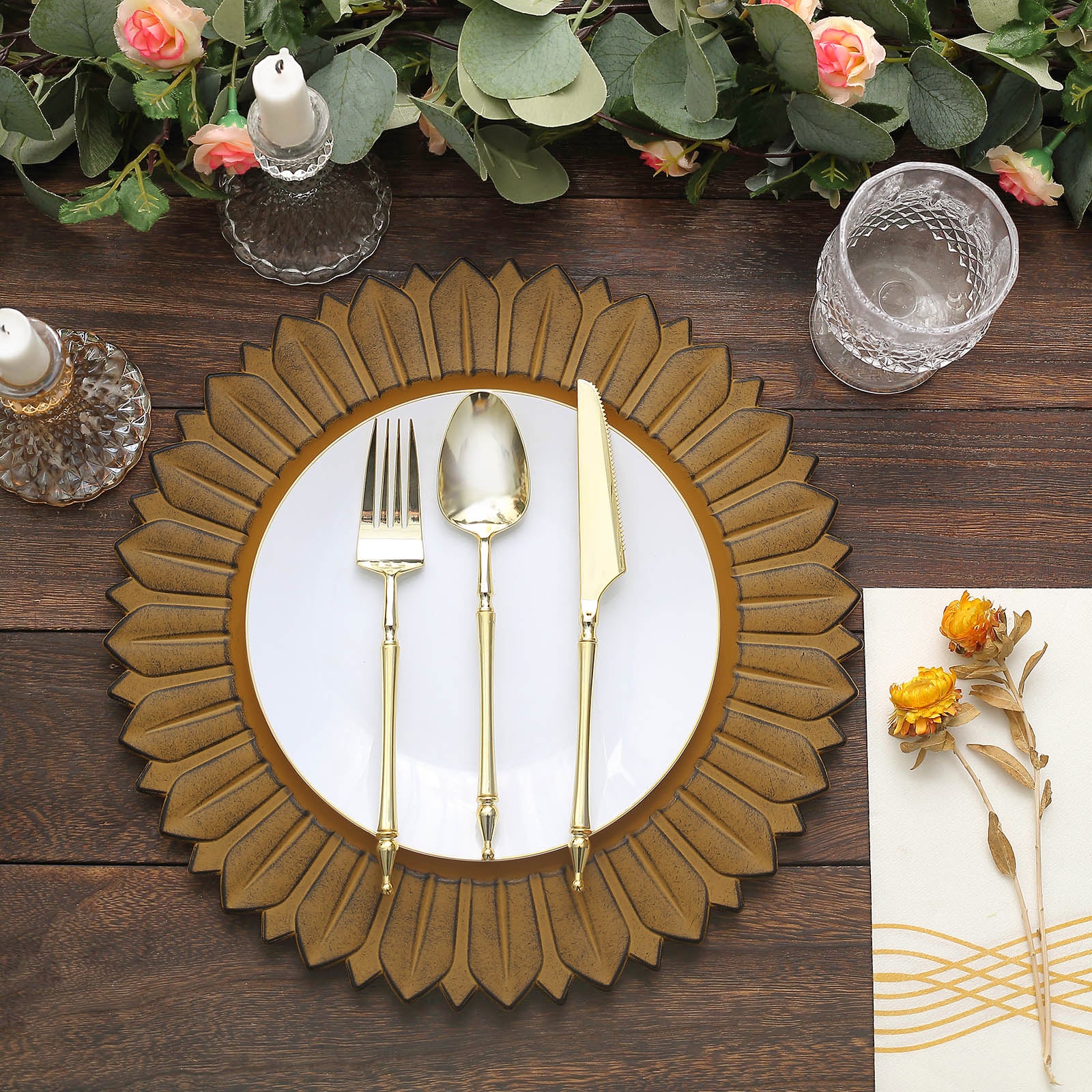 Matte mustard yellow sunflower charger plate with elegant gold utensils.