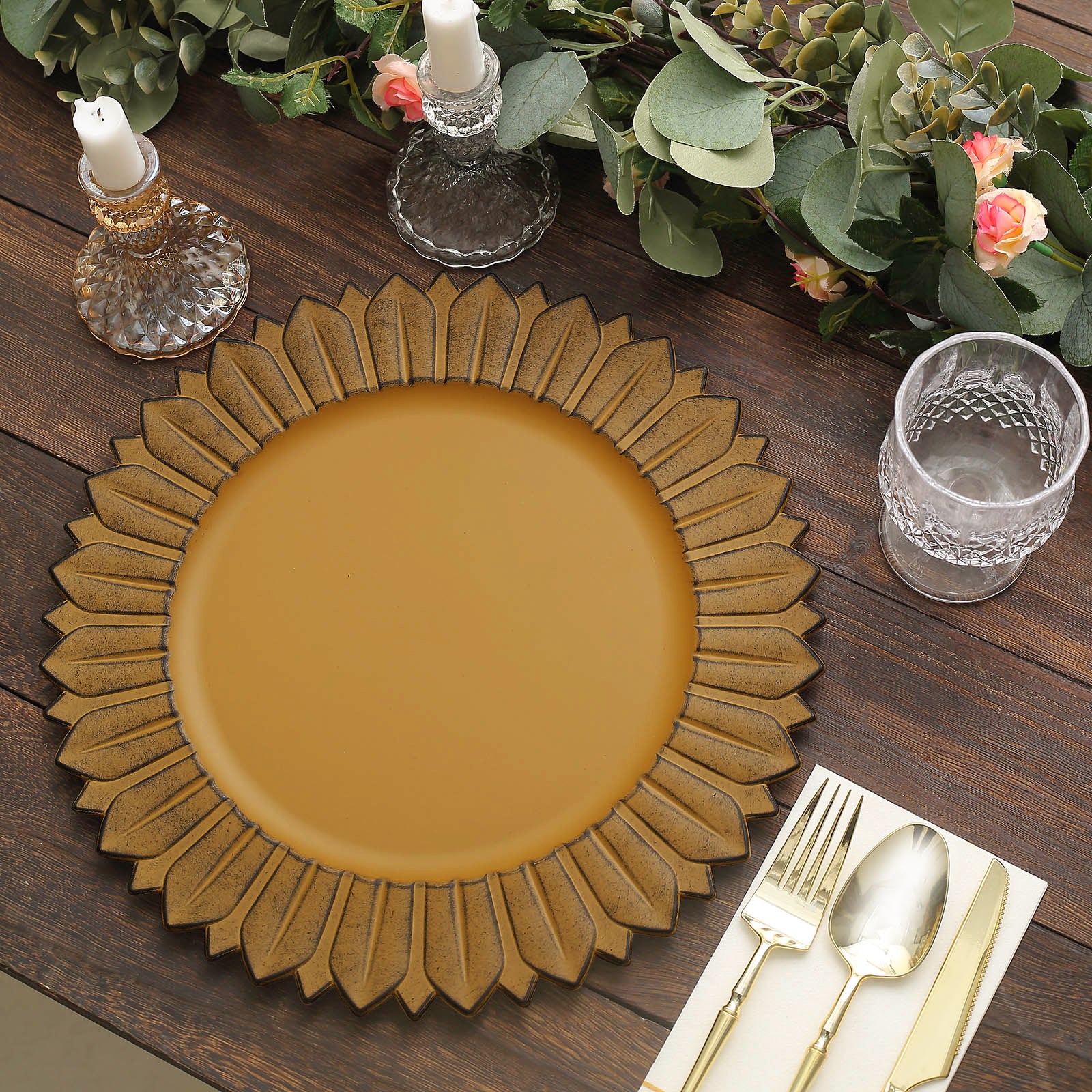 Matte mustard yellow sunflower charger plate on a rustic table setting.