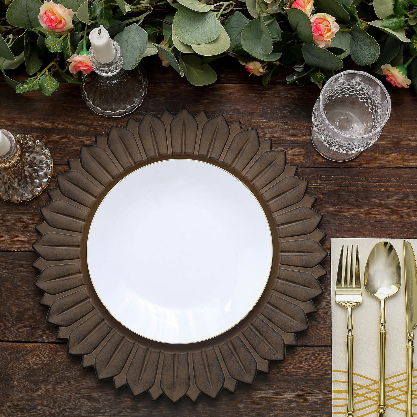 Matte natural sunflower disposable charger plate on a wooden table setting.