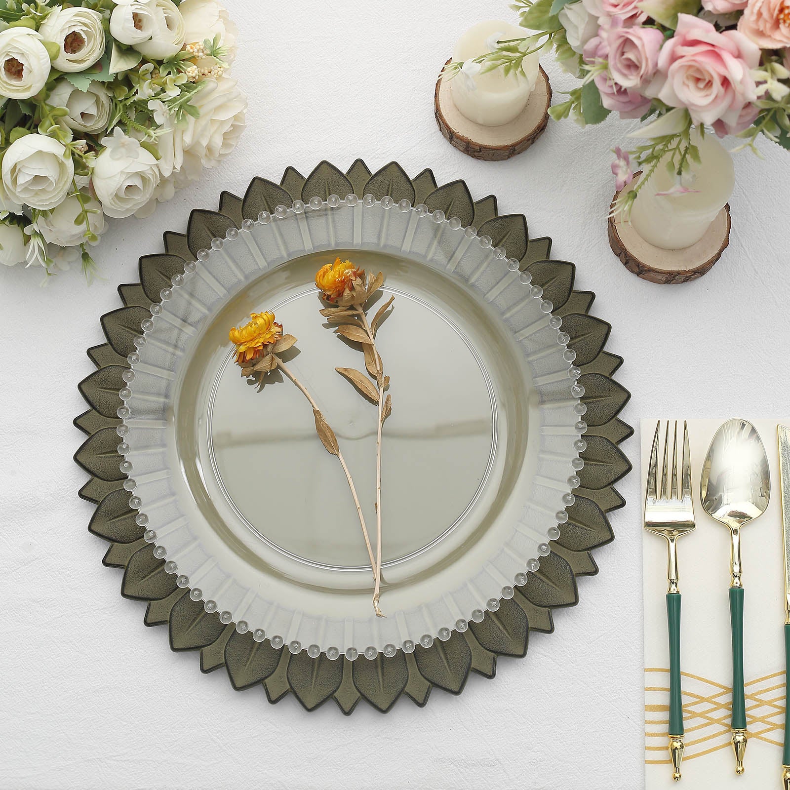 Matte olive green sunflower disposable charger plates arranged on a table setting.