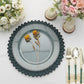 Matte teal sunflower disposable charger plate with floral decor.
