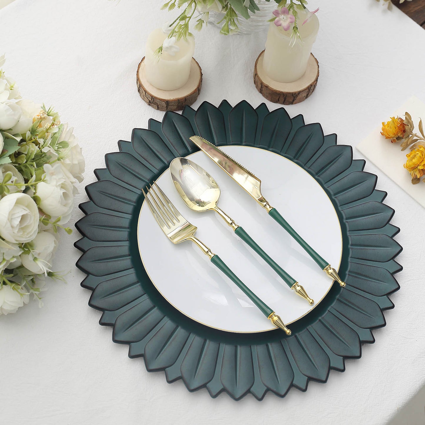 Matte teal sunflower disposable charger plate on a table setting.
