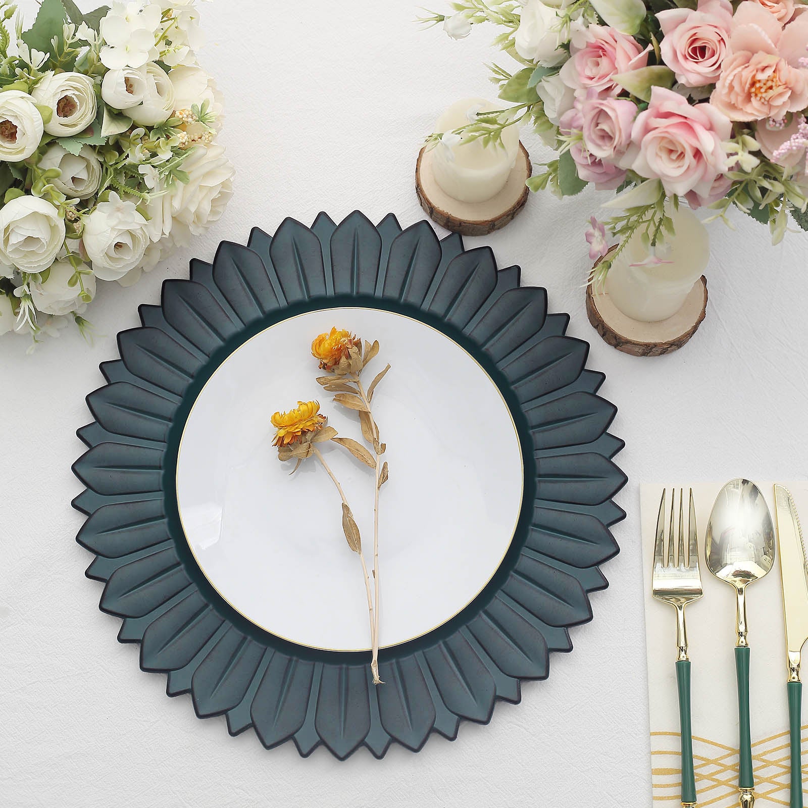 Matte teal sunflower charger plate with floral decor on a dining table.