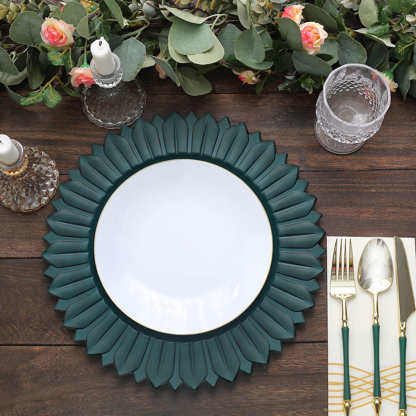 Matte teal sunflower disposable charger plate on a wooden table setting.