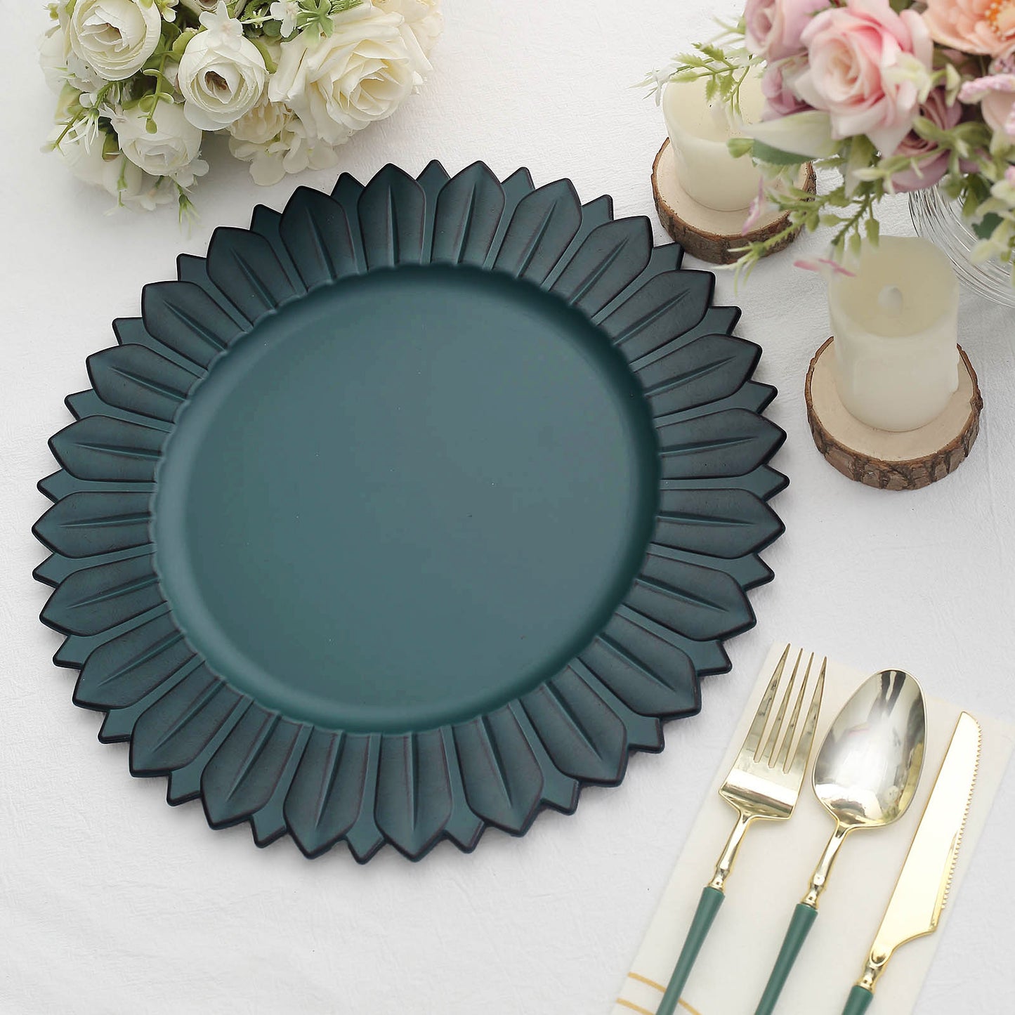 13" Matte Teal Sunflower Disposable Charger Plate on a table setting.