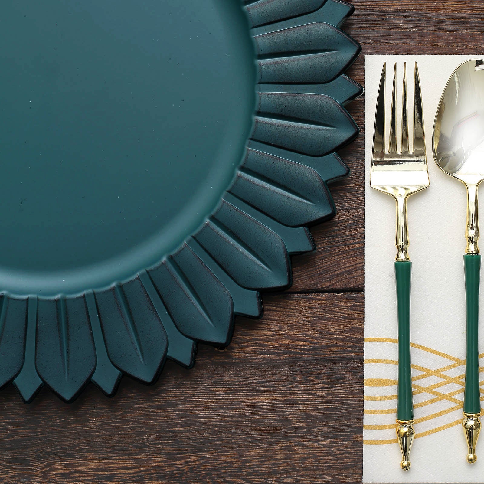 Matte teal sunflower disposable charger plate on wooden table setting.