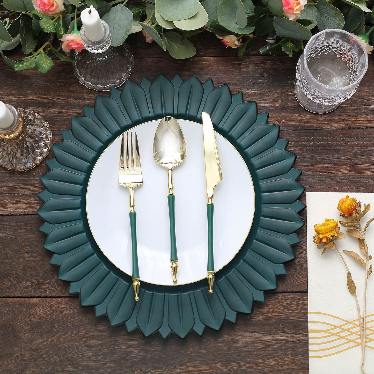 Matte teal sunflower disposable charger plate with gold-accented cutlery.