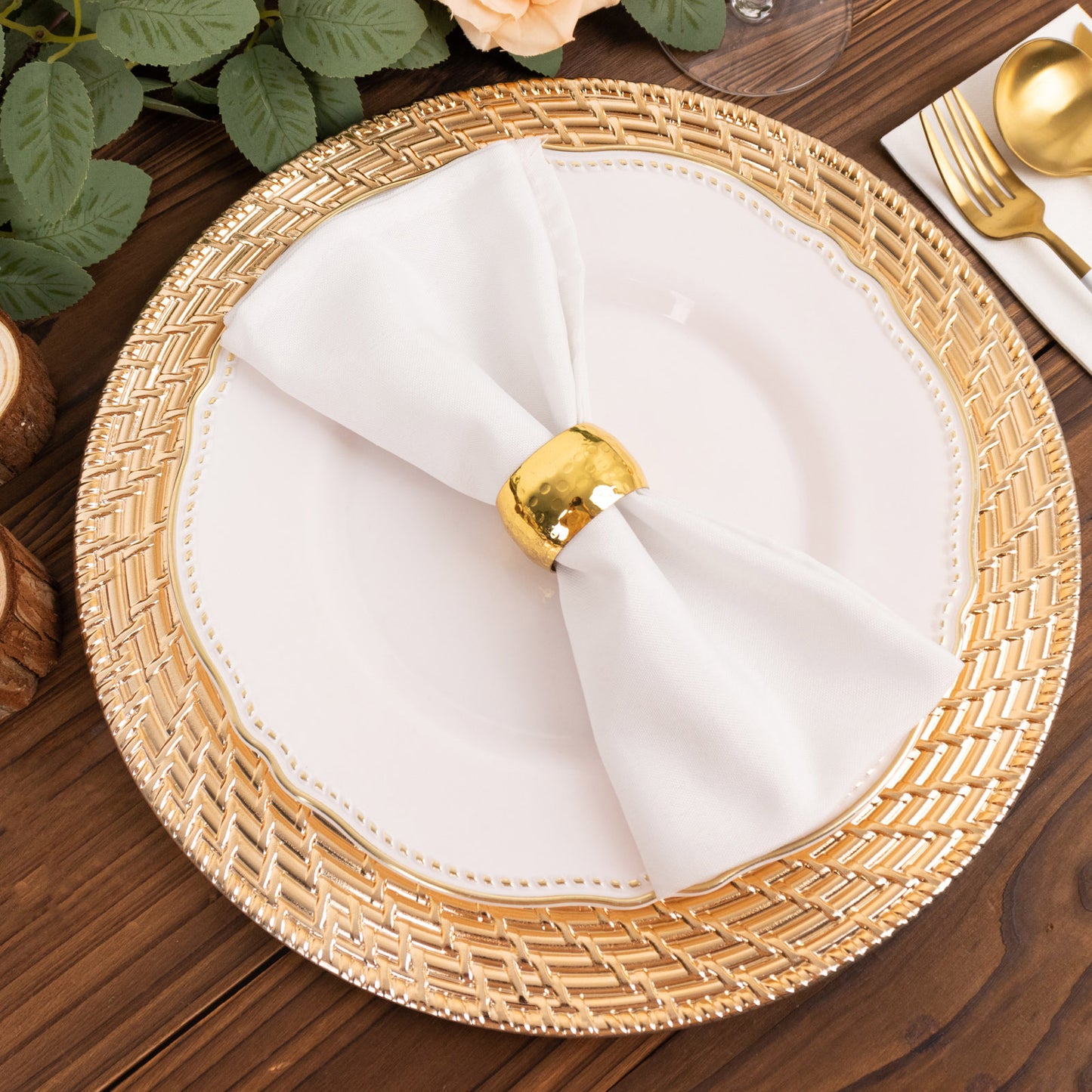 Metallic gold swirl rattan acrylic charger plate on a wooden table.